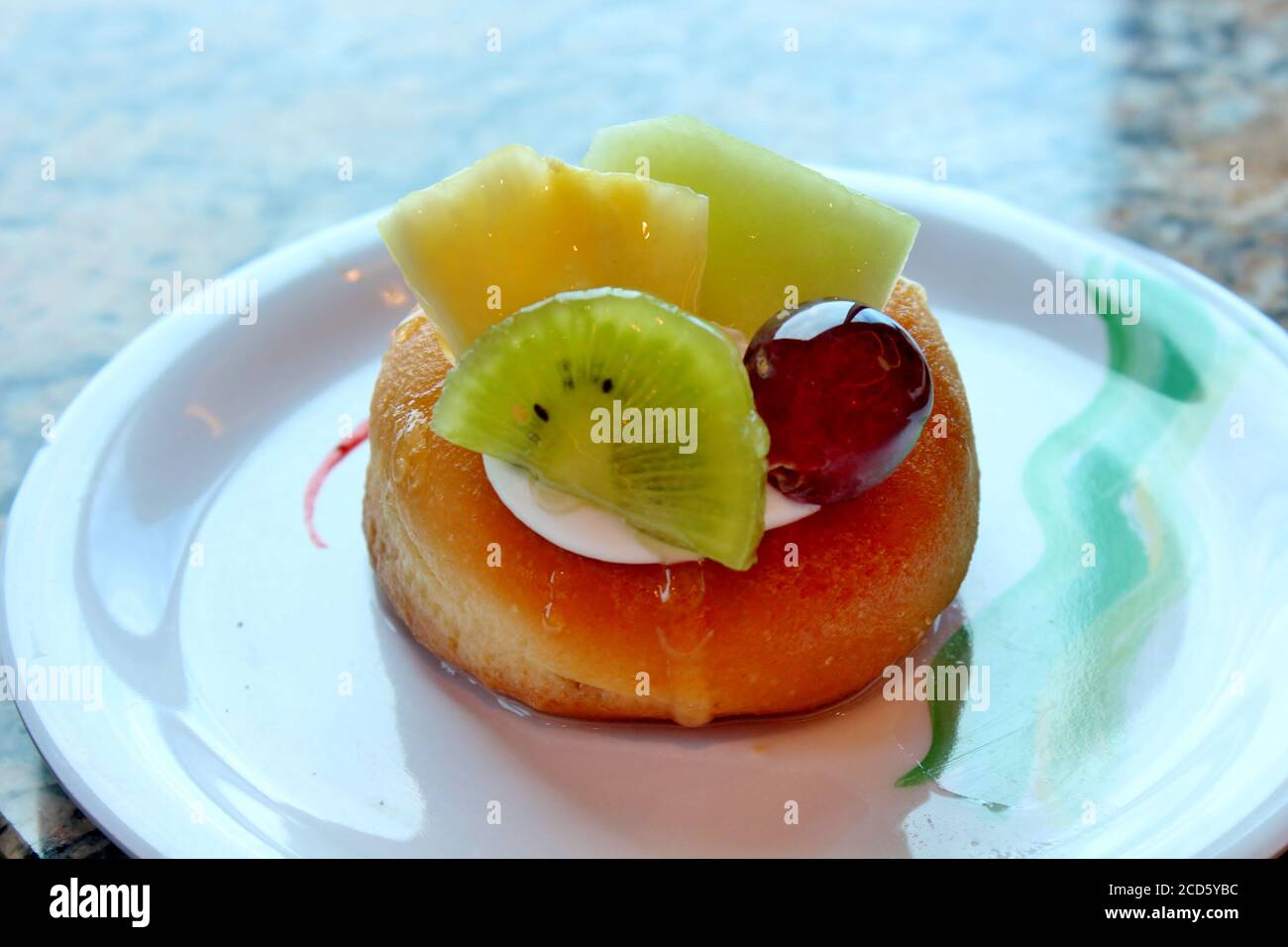 Cake dessert with kiwi, pineapple and grapes Stock Photo