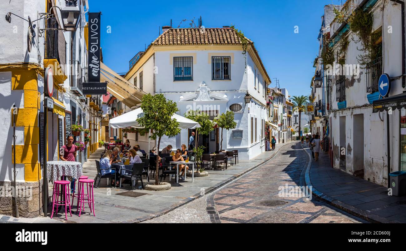 Sidewalk cafe and street in Cordoba, Andalusia, Spain Stock Photo