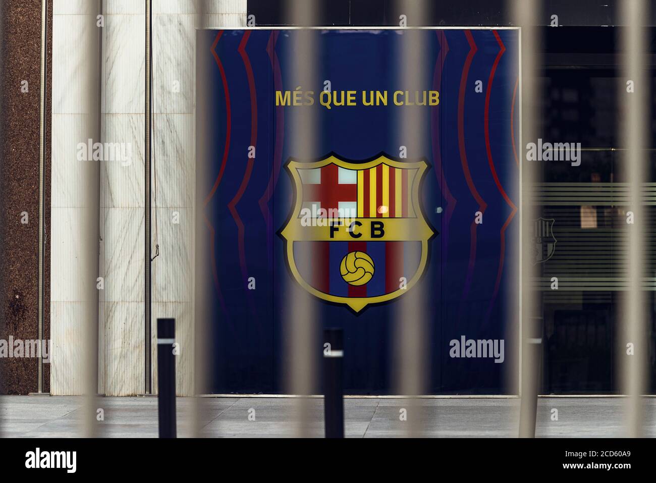 Barcelona, Spain. 26th Aug, 2020. View of the FC Barcelona logo behind the closed gates of the Camp Nou stadium after the six-time world footballer announced that he wanted to leave the club. 'Together with the best player in history, we want to transform the team for the future,' said sports director Planes. Credit: Matthias Oesterle/dpa/Alamy Live News Stock Photo