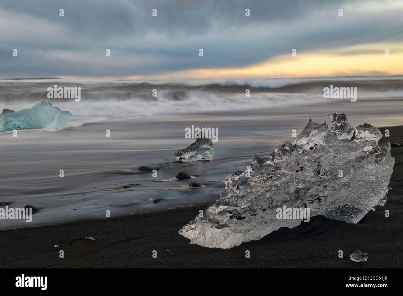 Landscape with ice piece on beach at sunset, Iceland Stock Photo