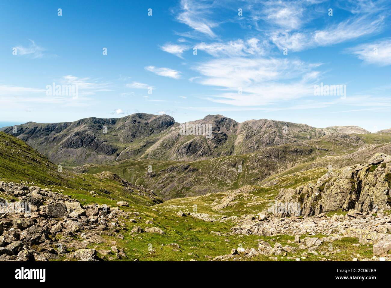 Scafell and Scafell Pike viewed from Crinkle Crags on a glorious summer day Stock Photo