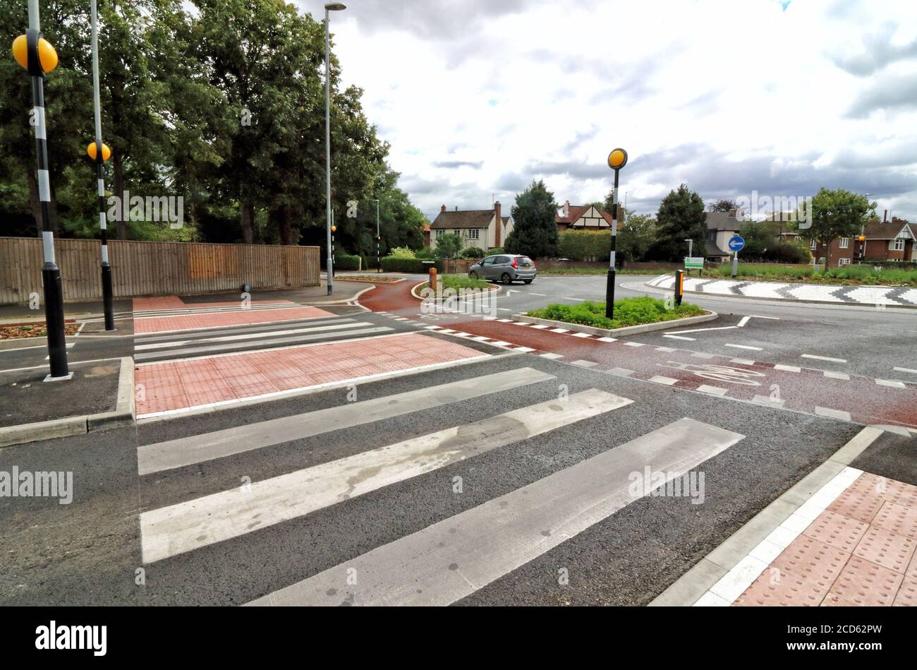 Cambridge, UK. 26th Aug, 2020. Pedestrian crossing and Inner cycle only lane leading to the roundabout.Britain's first Dutch-style roundabout opened recently in Cambridge at a cost of Â£2.3 million, prioritises cyclists and pedestrians. Cyclists have an outer ring on the roundabout, with cycle crossings over each of the four approach roads in a contrasting red surface. Credit: Keith Mayhew/SOPA Images/ZUMA Wire/Alamy Live News Stock Photo