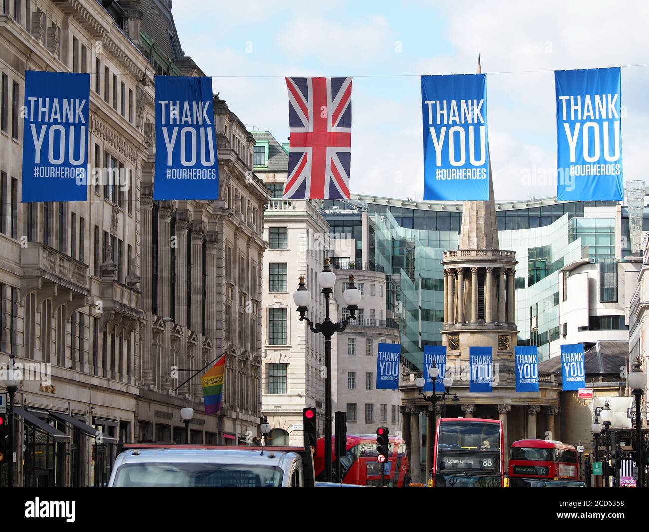 View looking along lines of many flags hanging above Langham Place in London thanking our heroes during the Covid 19 pandemic in 2020 Stock Photo