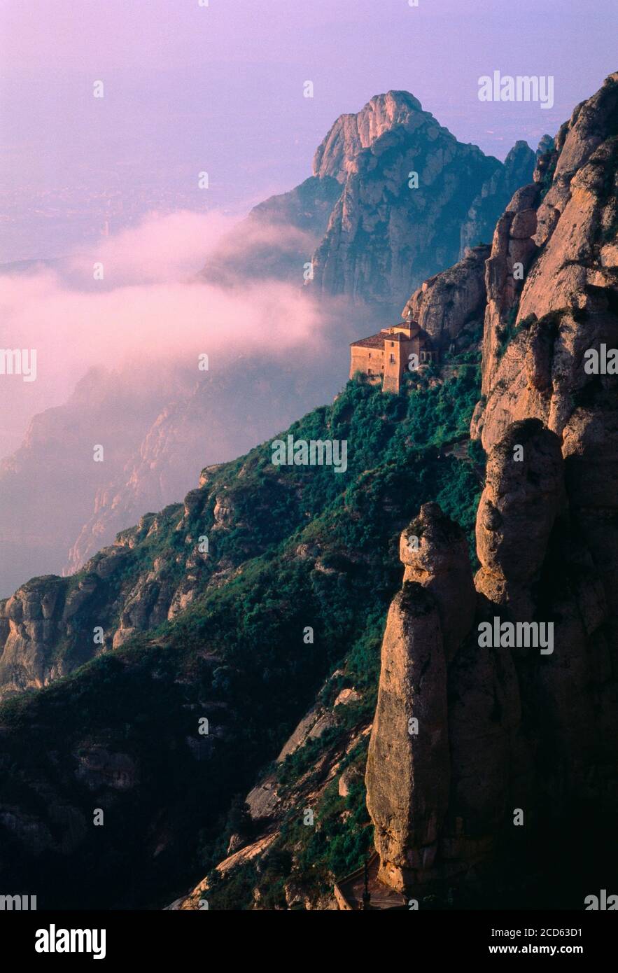 Santa Cova Monastery on mountainside, Sierra de Montserrat, Catalonia, Spain Stock Photo
