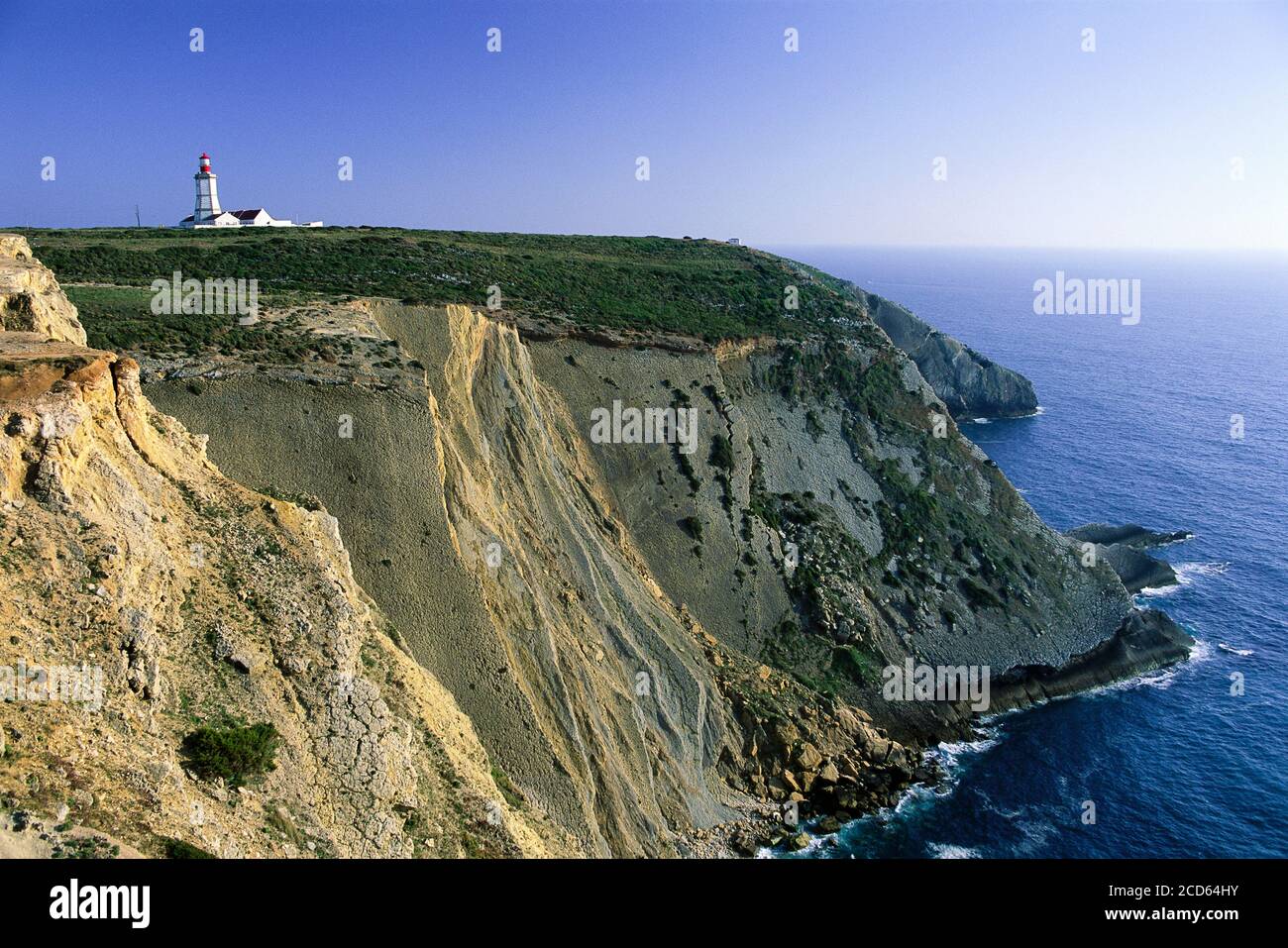 Landscape with lighthouse and cliffs, Cape Espichel, Portugal Stock Photo