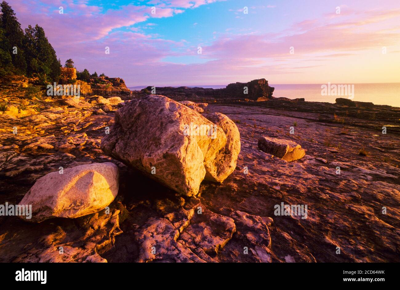 Landscape with rocky coastline at sunset, Bruce Peninsula National Park, Ontario, Canada Stock Photo