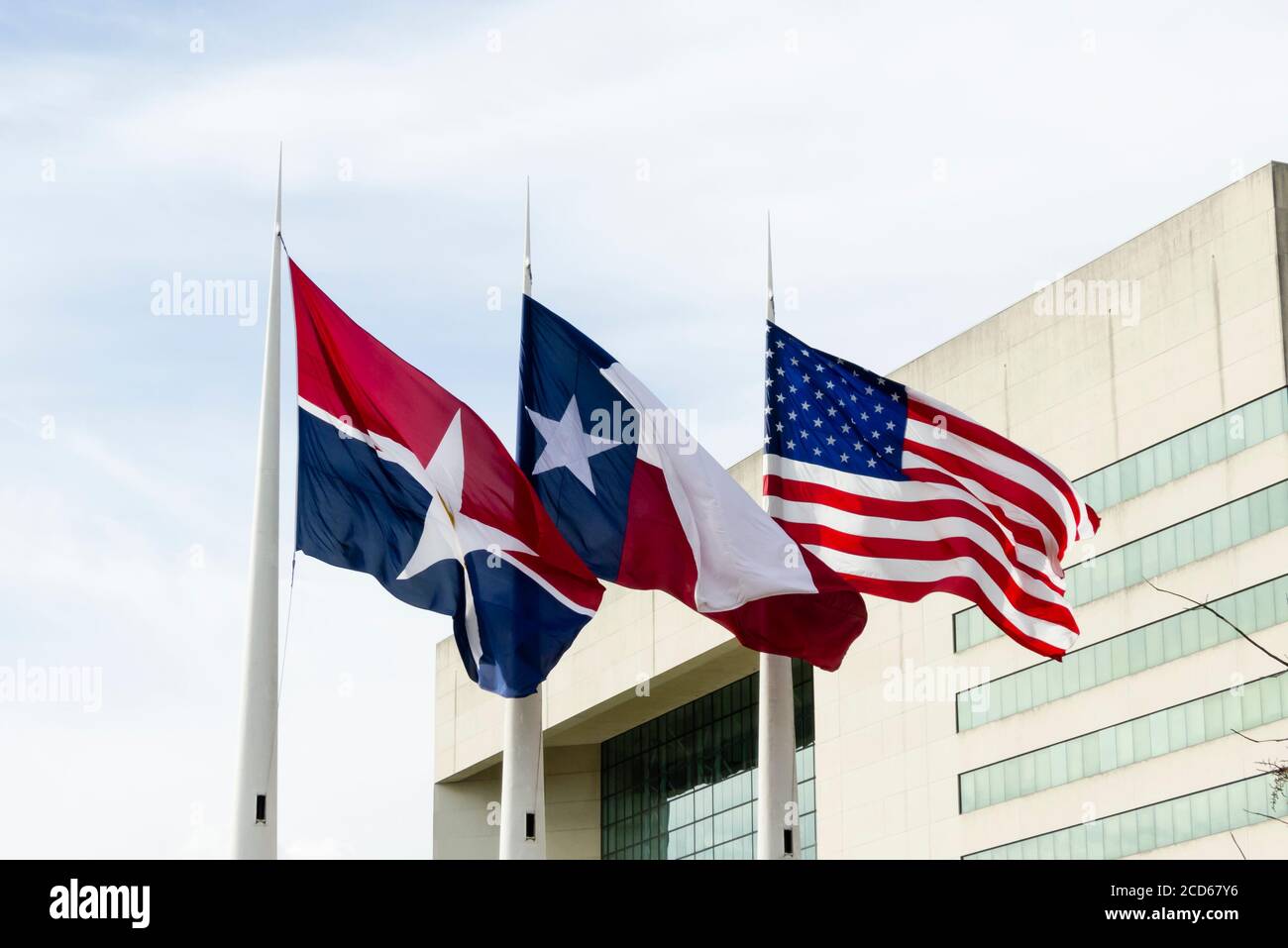 Flags of Dallas, Texas and US on the wind Stock Photo