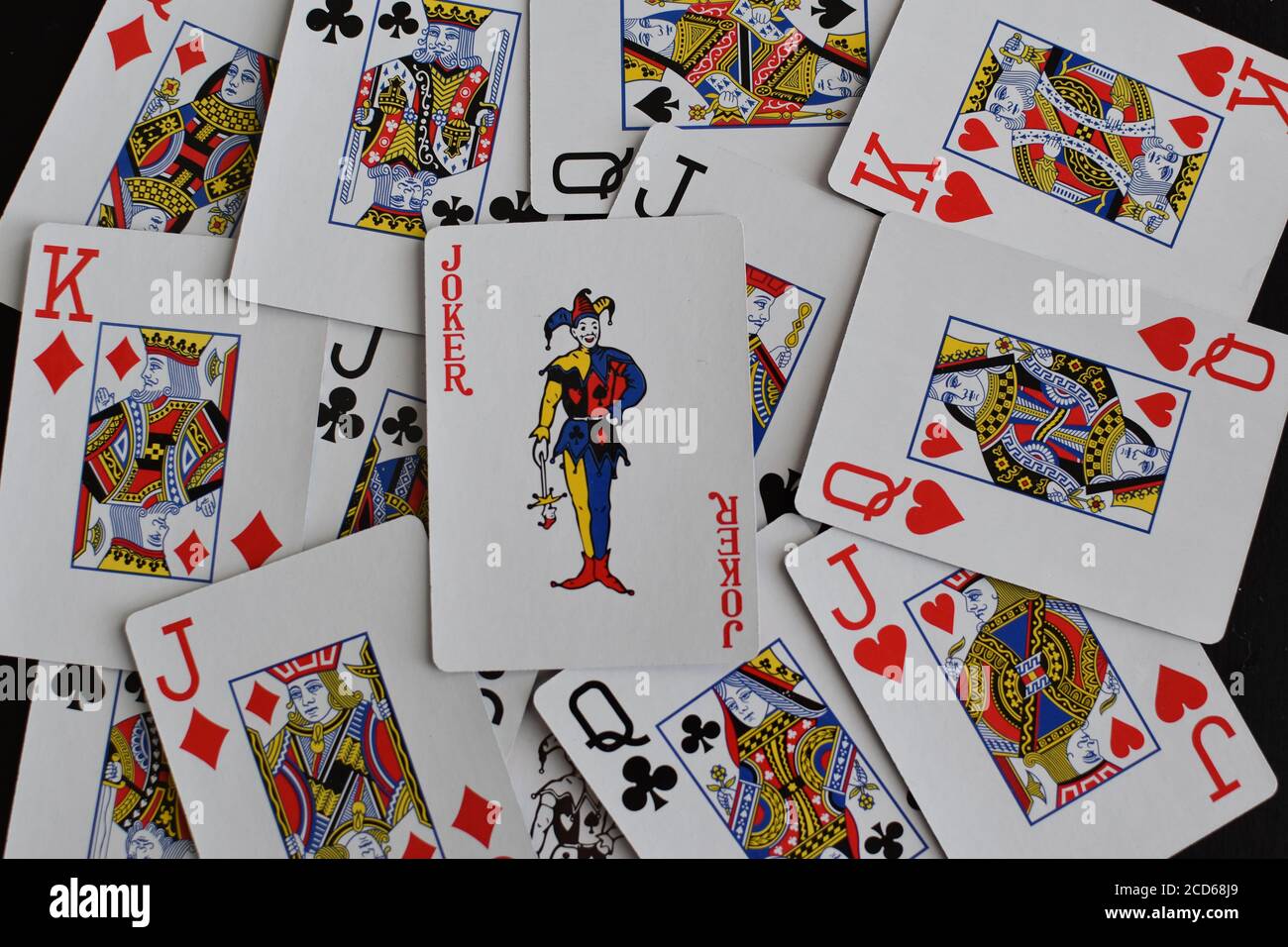 playing card joker on the background of scattered cards Stock Photo - Alamy