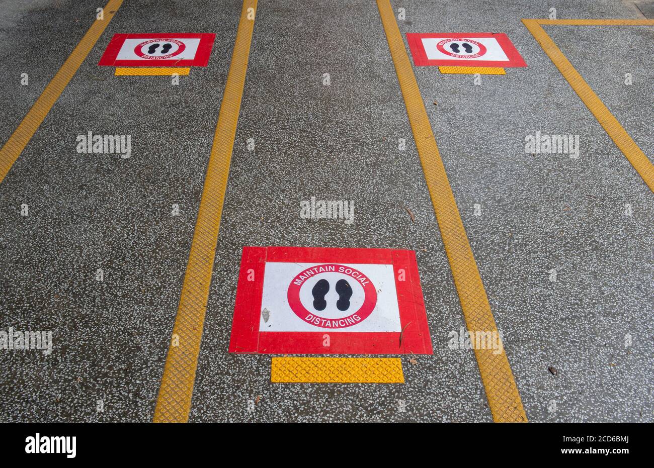 Hong Kong,China:26 Aug,2020.  Social distancing markers on the pavement at the bus top at The Hong Kong University of Science and Technology, Clearwat Stock Photo