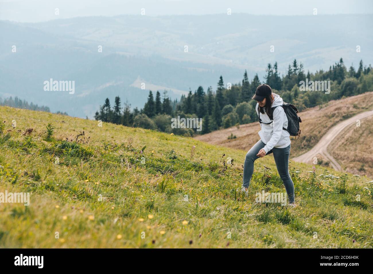 Stylish woman backpack hiking hi-res stock photography and images - Alamy