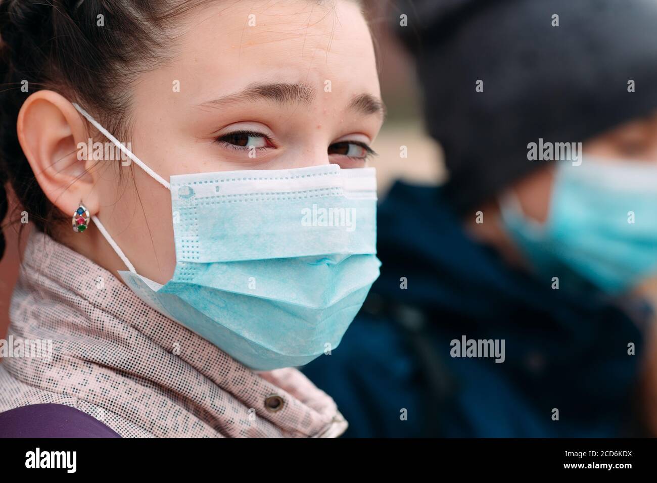 Schoolage children in medical masks. portrait of school children Stock