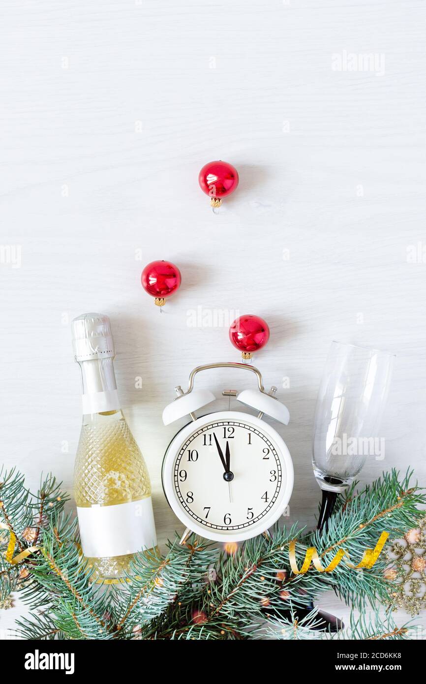 New Year's background with champagne bottle, fir branches and Christmas ...