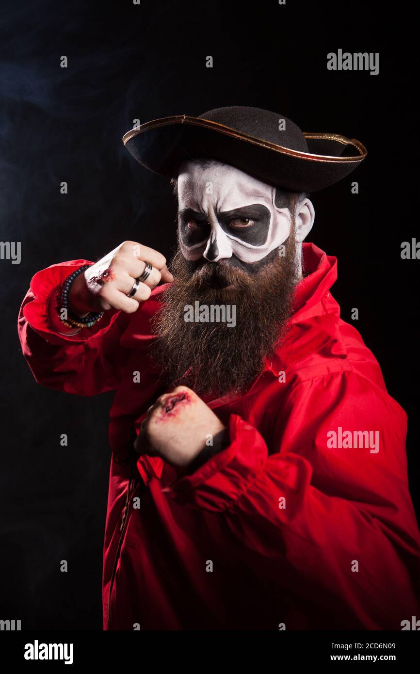 Medieval mariner with beard and hat isolated over black background