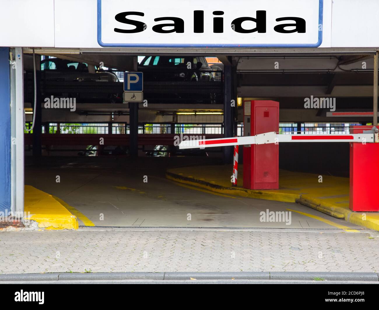 Barrier at the exit of a car parking garage with sign "Salida Stock