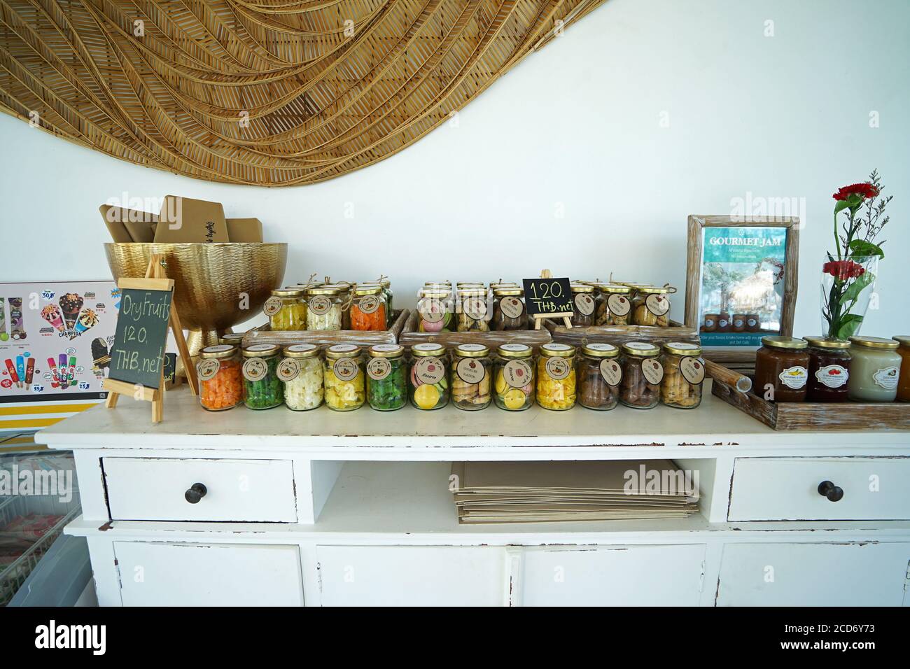 Glass souvenir jars of dry fruits displayed in tropical dining