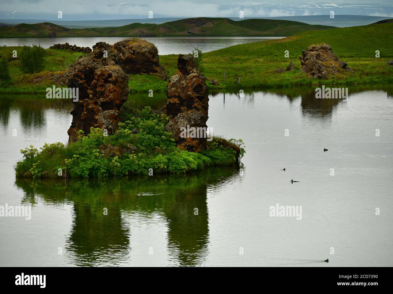 Klasar formation rising out of the water in the Skutustadhir area. Lake Myvatn, Iceland Stock Photo