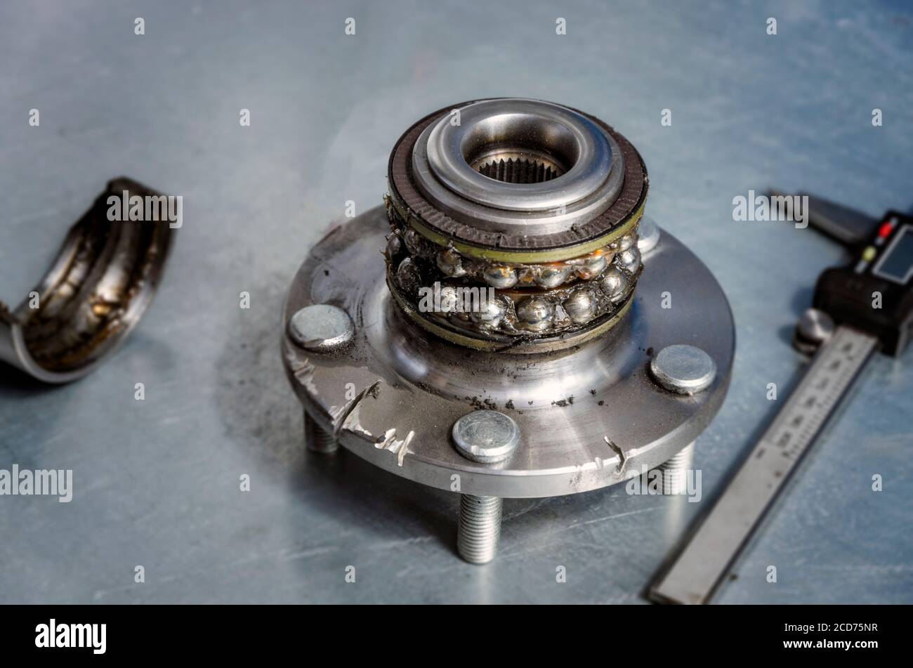 Broken hub, with visible bearings and grease Stock Photo Alamy