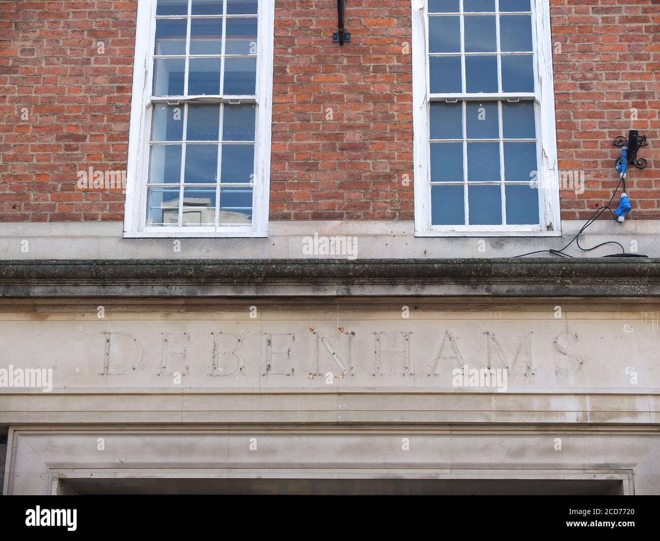 The ghostly imprint of sign letters for struggling UK chain department store Debenhams above a former shop on Davygate in York which has closed down Stock Photo