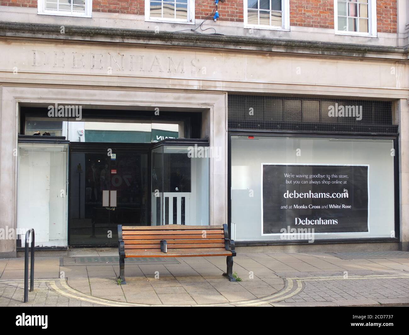 Closed down branch of chain department store Debenhams on Davygate in York UK with ghostly imprint of sign letters & sign in window saying it has shut Stock Photo
