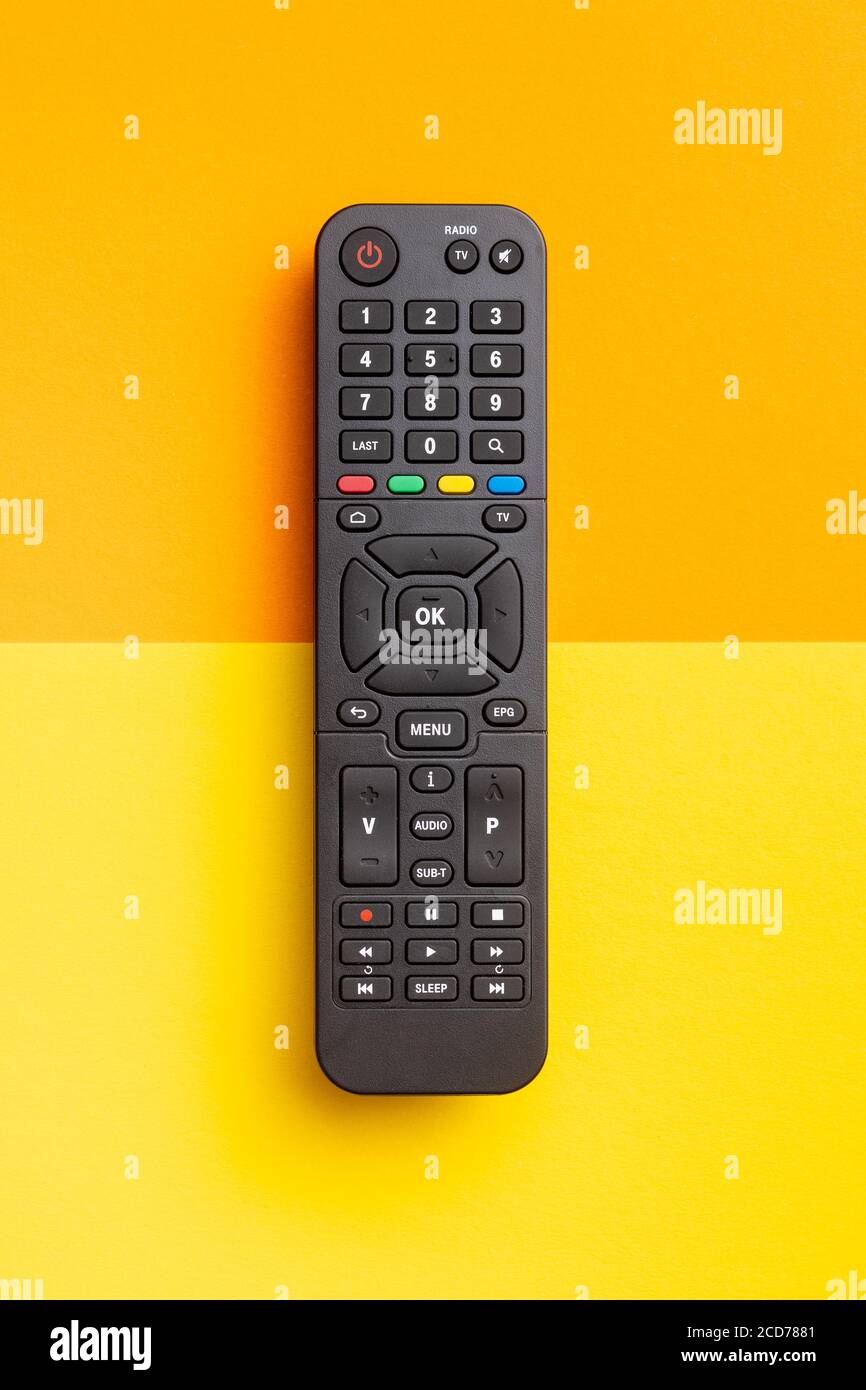 TV remote control on colorful background. Top view. Stock Photo