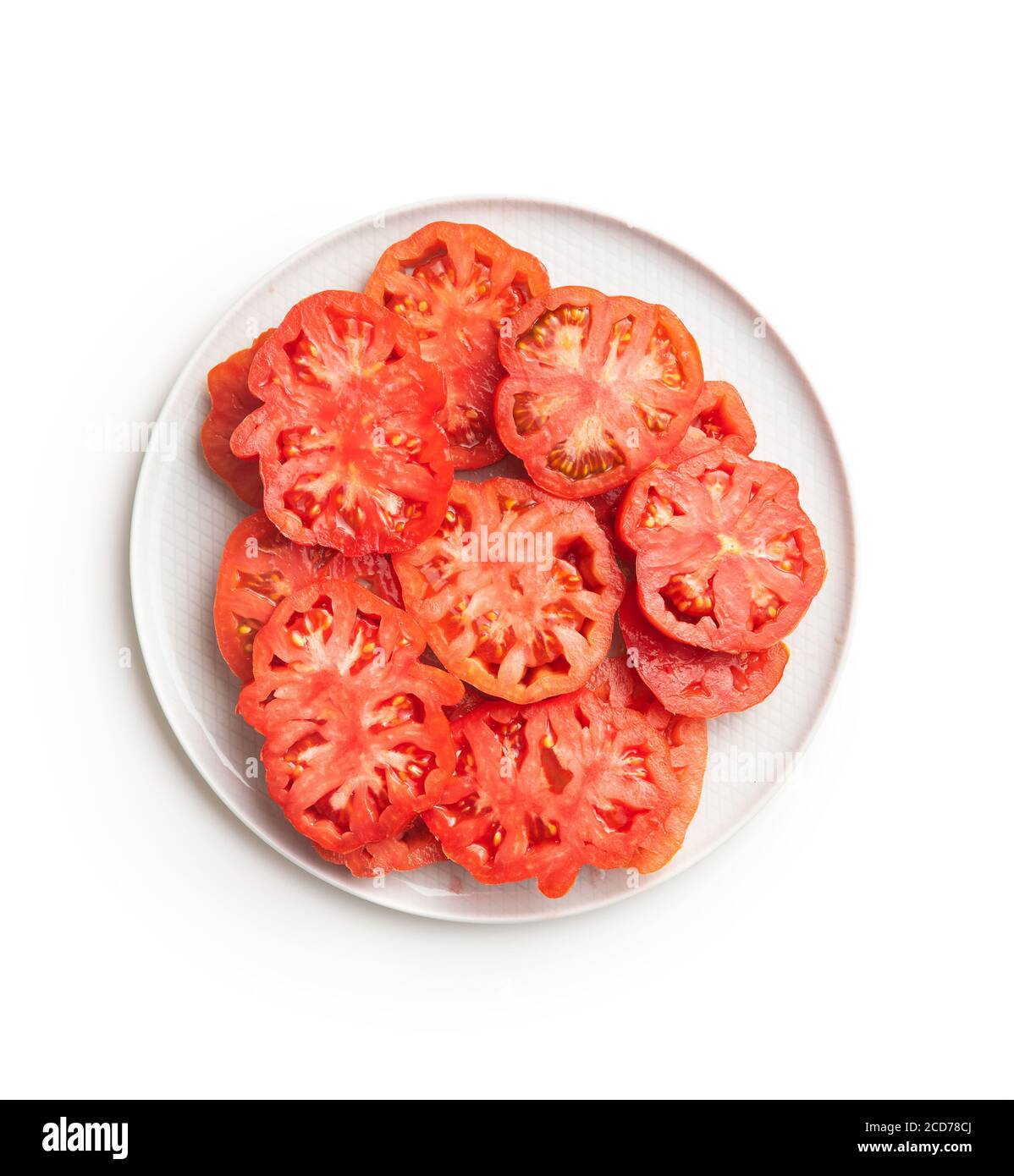 Sliced red beefsteak tomatoes isolated on white backround. Stock Photo