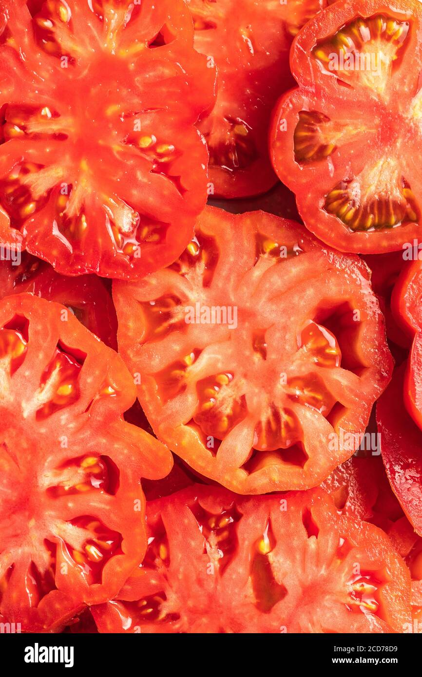 Slced red beefsteak tomatoes. Top view. Stock Photo