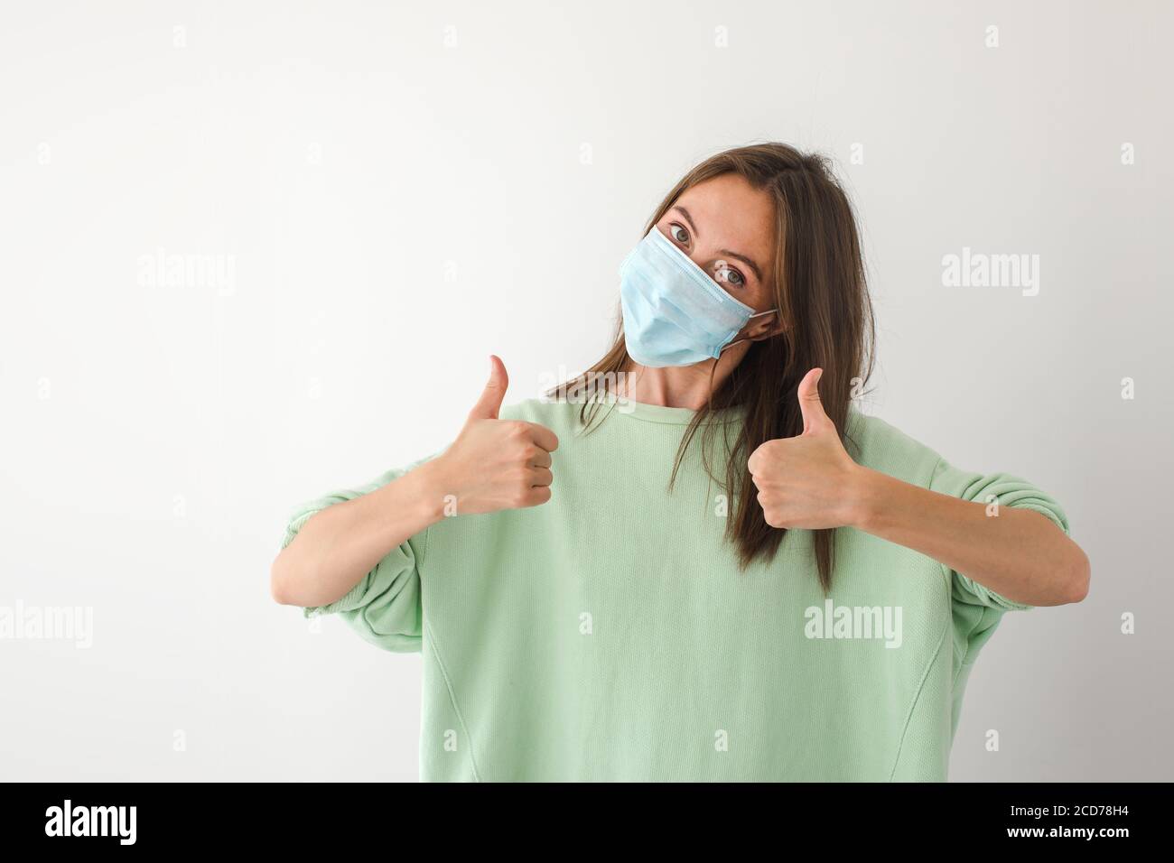 Caucasian young woman with disposable face mask Stock Photo