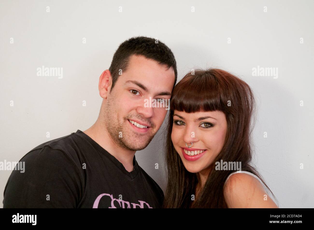 Young couple smiling and looking at the camera. Stock Photo