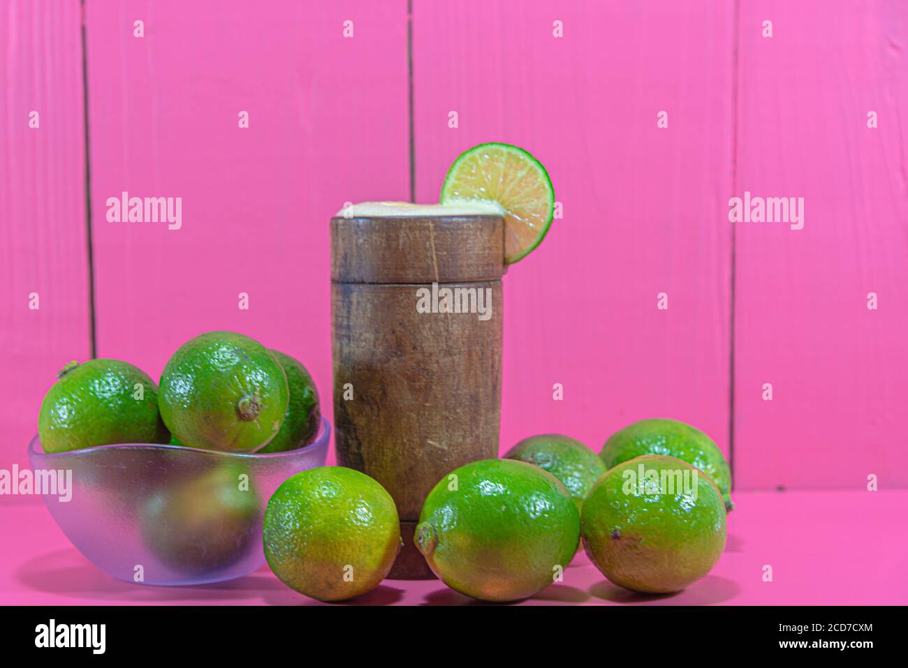 Lemon juice and fruits. Tahiti lemon (Citrus × latifolia). Citrus drink