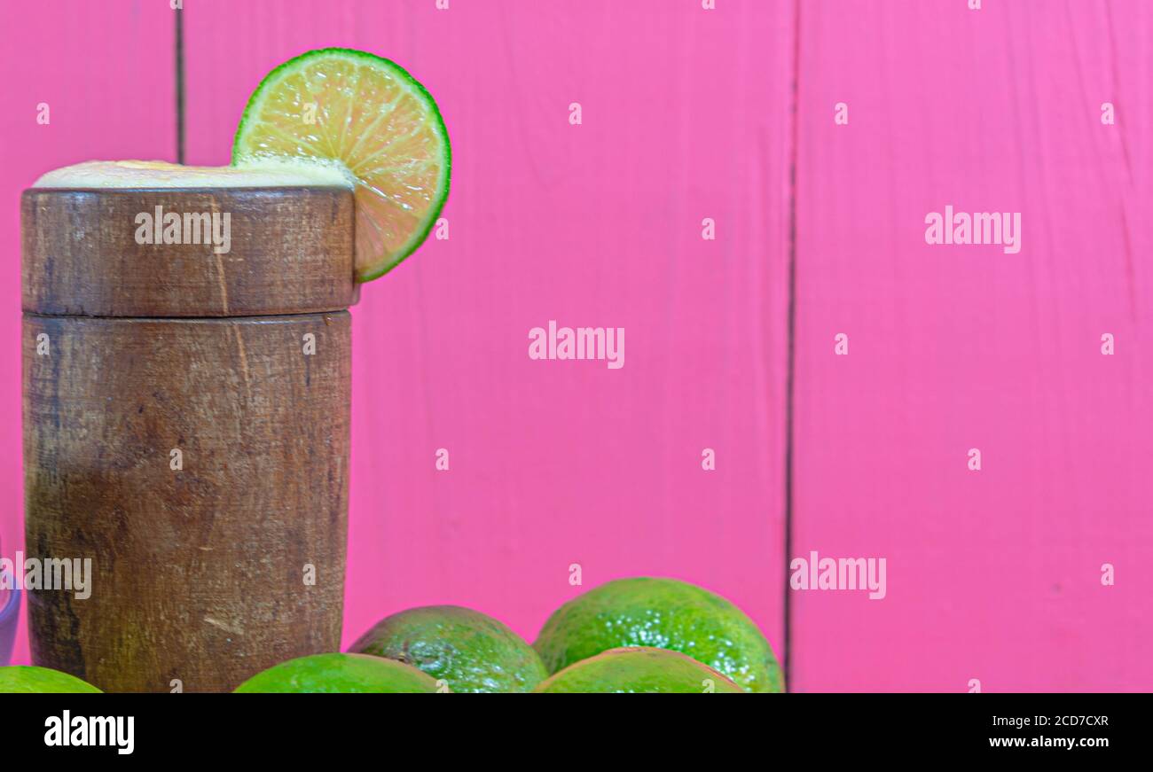 Lemon juice and fruits. Tahiti lemon (Citrus × latifolia). Citrus drink