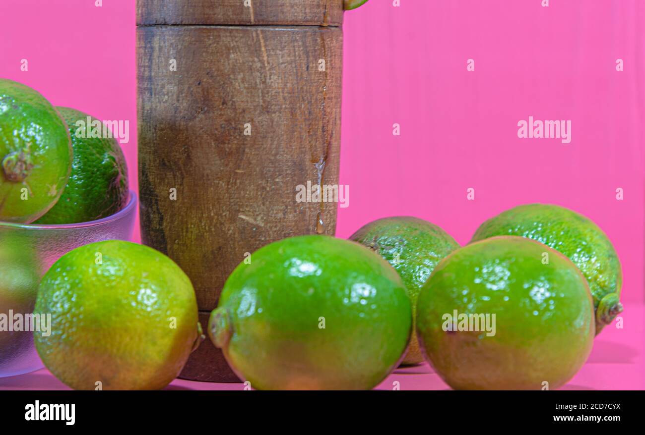 Lemon juice and fruits. Tahiti lemon (Citrus × latifolia). Citrus drink