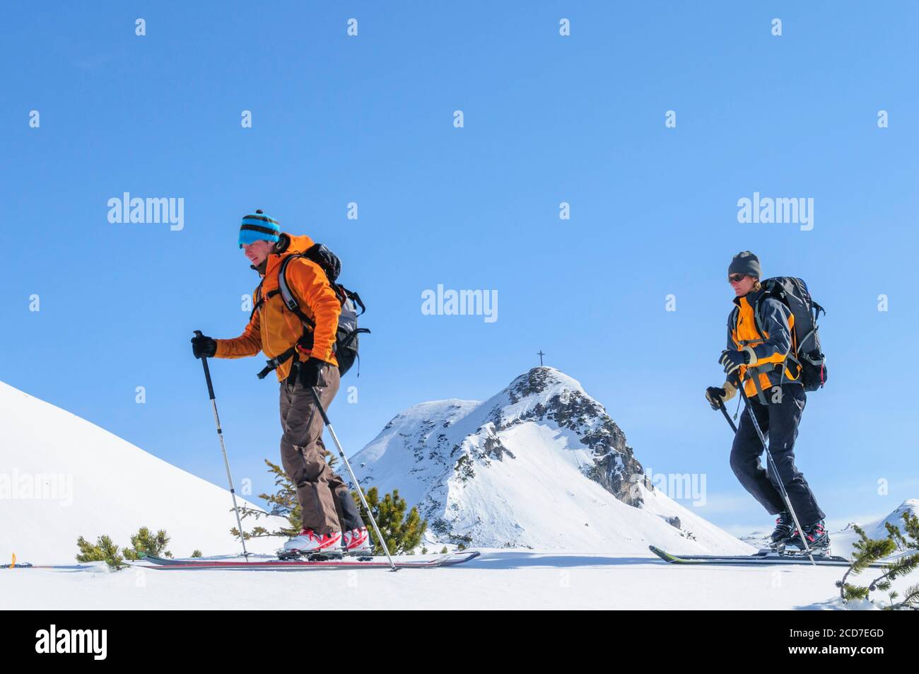 Alpinists during ascent with skis Stock Photo