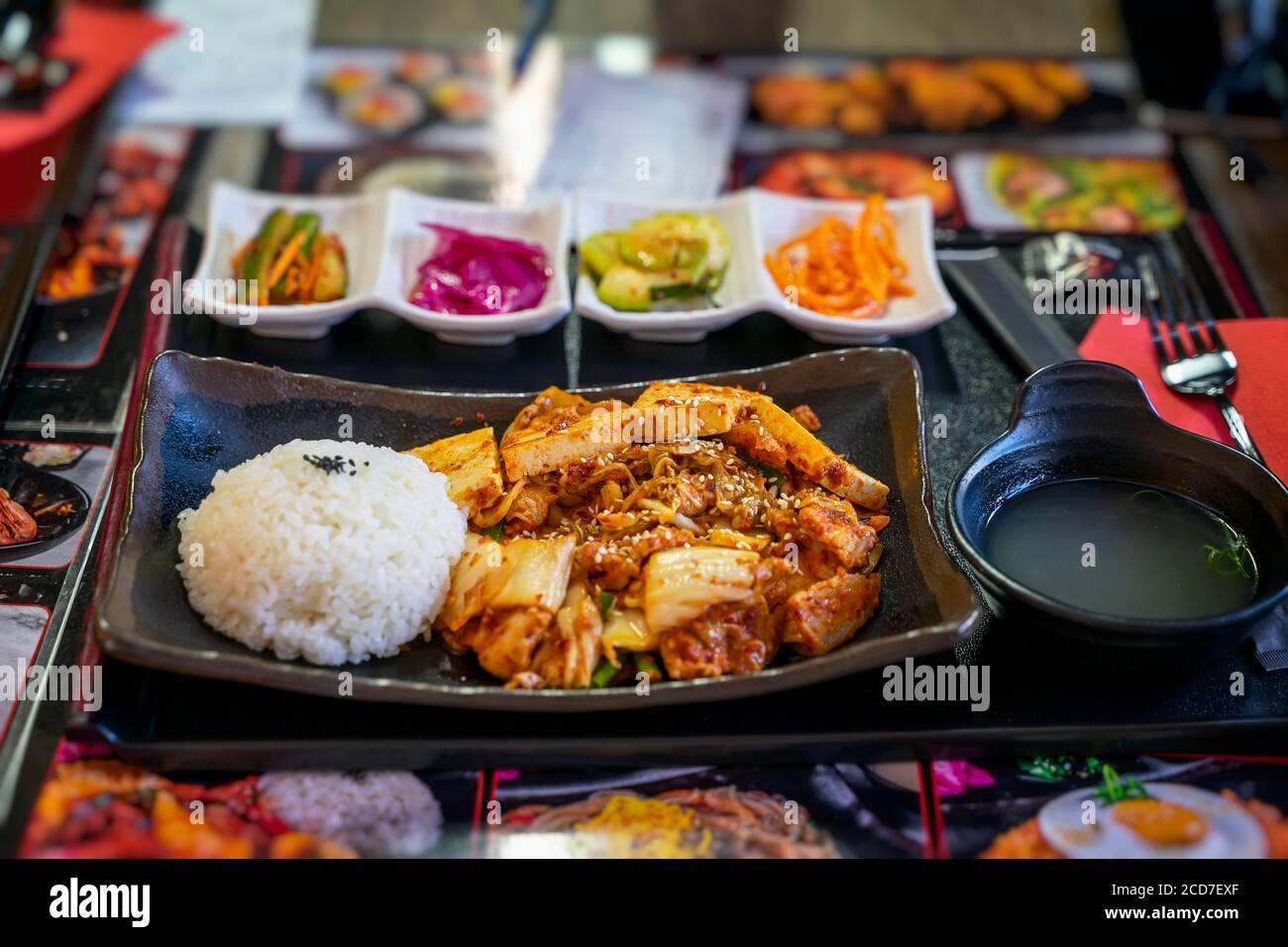 Plate of rice and fried tofu cheese, bowl of soup. Top view. National food, asian dishes concept