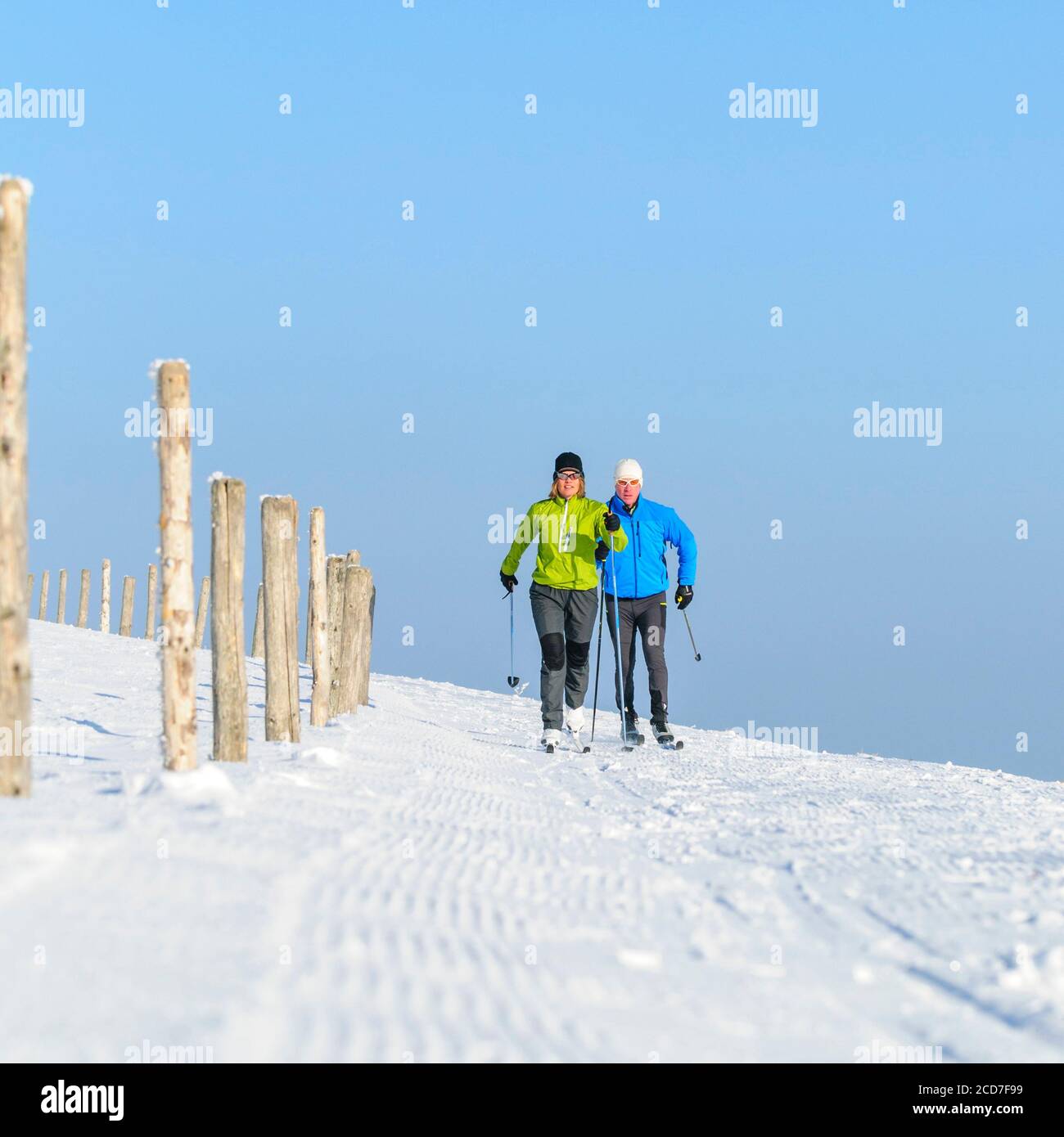 Couple making a relaxed tour in nature with nordic cruising skis Stock Photo