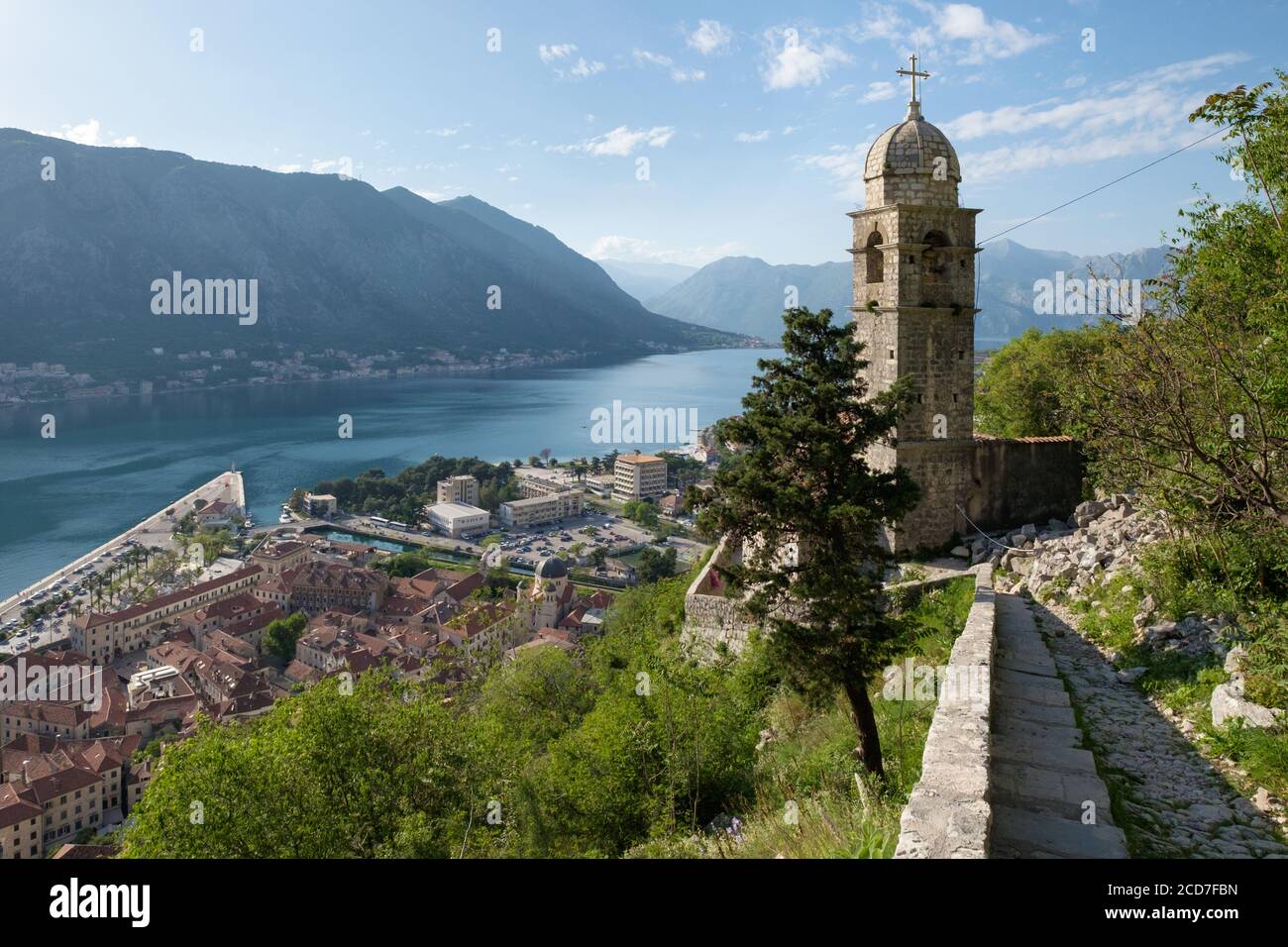 The bell tower of the Church of Our Lady of Health (Church of our Lady of Remedy) and the Bay of Kotor from the Ladder of Kotor/Cattaro Stock Photo