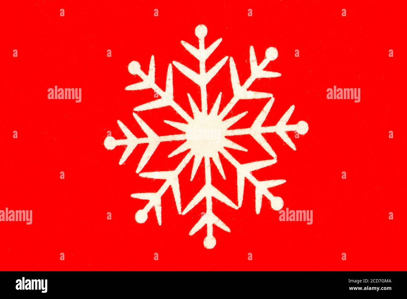 White isolated snowflake on a red background Stock Photo - Alamy