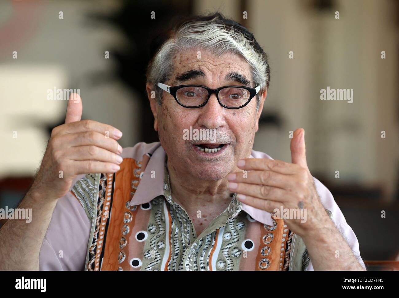 Salah Tizani, 92, known as Abou Salim and one of Lebanon’s first TV celebrities, speaks during an interview with Reuters at a cafe in Beirut, Lebanon August 12, 2020. Picture taken August 12, 2020. REUTERS/Mohamed Azakir Stock Photo