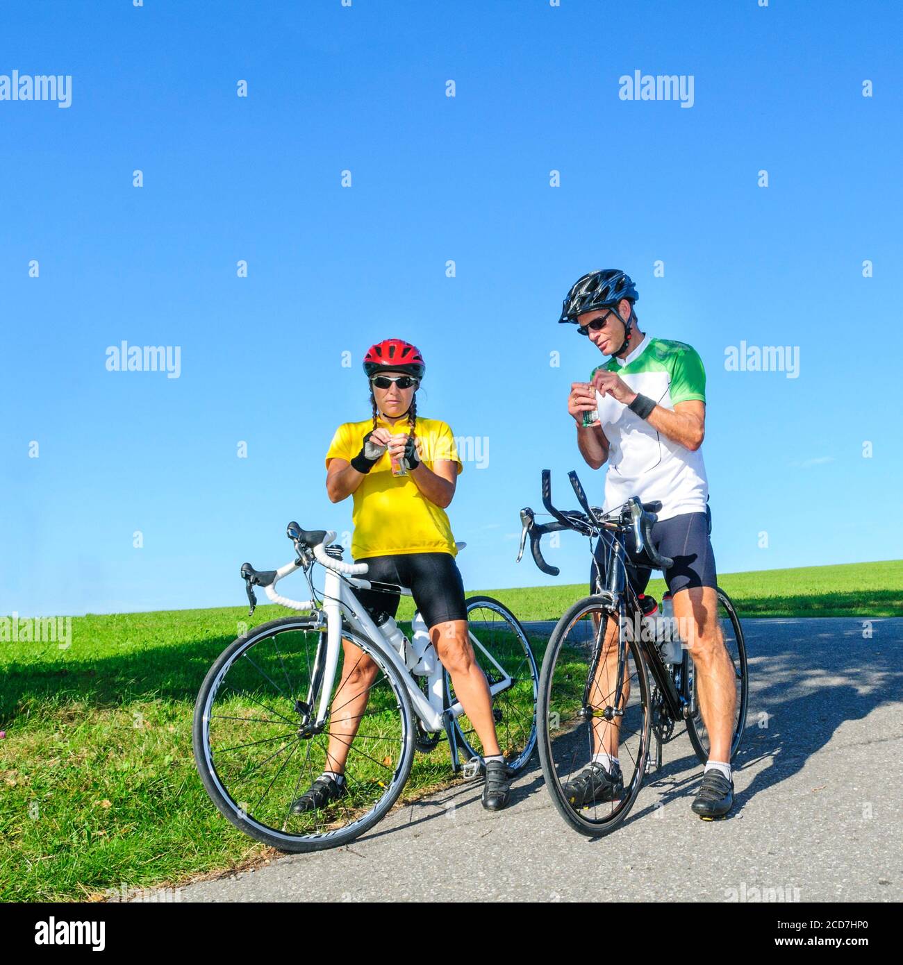 Cyclists with race bike during break in nature Stock Photo Alamy