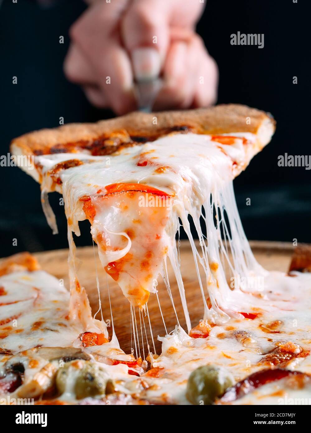 Pizza with very much cheese melting Stock Photo Alamy