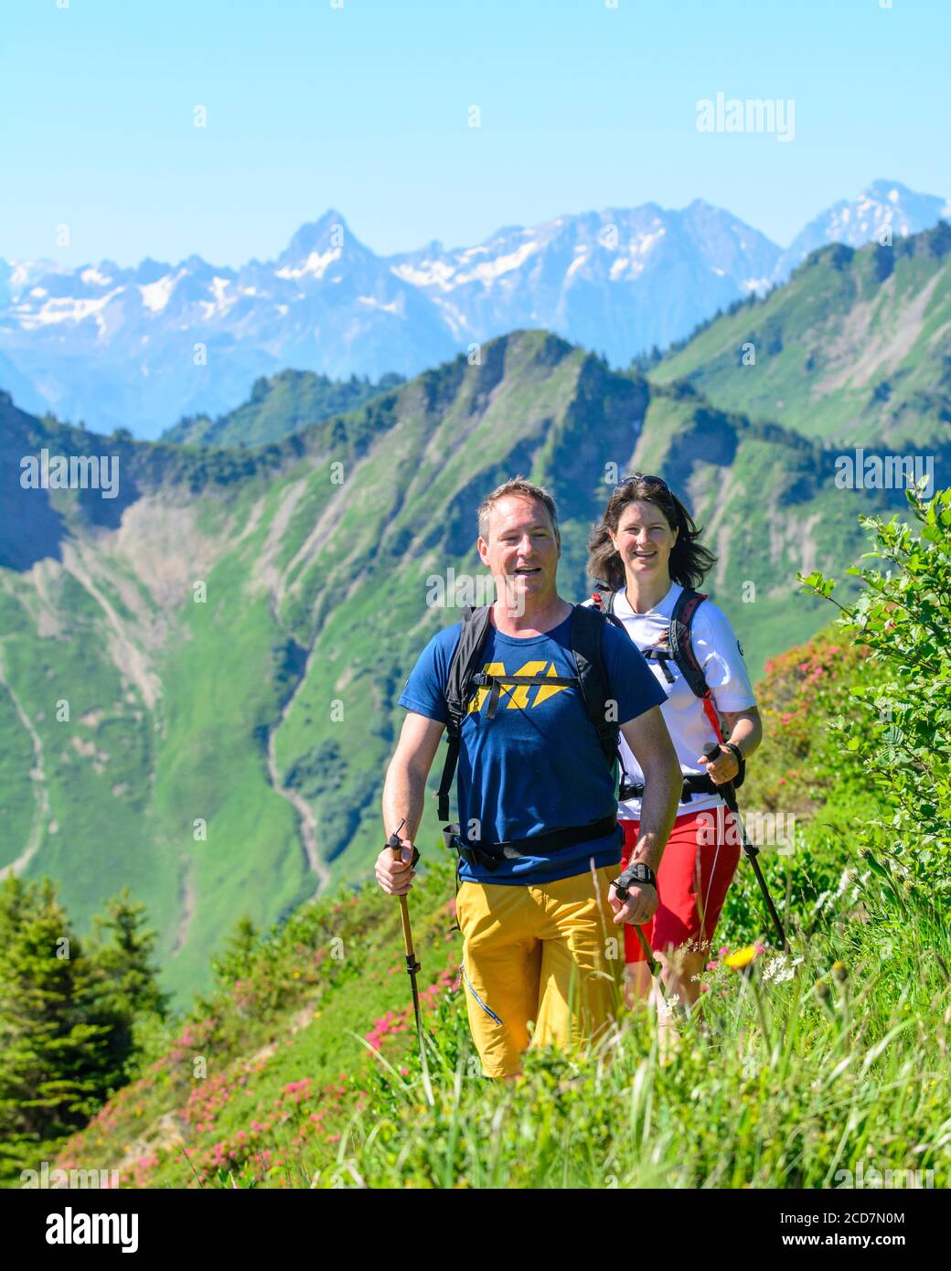 Couple hiking in alpine area in Vorarlberg mountains in austria Stock ...