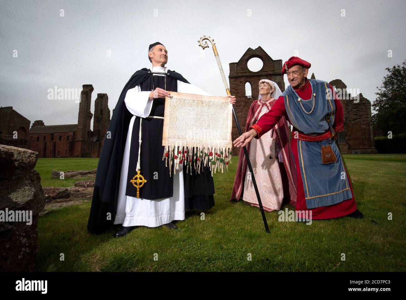 Historical actors (left to right) Ken Lownie, Vina Smith and Bill Smith at Arbroath Abbey to mark the 700th anniversary of the Arbroath Declaration, a document attempting to confirm Scotland's status as an independent sovereign state. Stock Photo