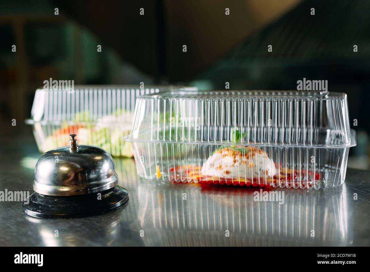 food delivery. distribution table in a restaurant with a metal bell ...
