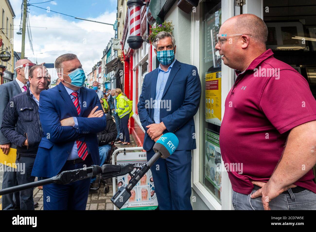 Bantry, West Cork, Ireland. 27th Aug, 2020. The Minister for Public Expenditure, Michael McGrath TD (FF), visited  Bantry today to see the flood damage caused by Storm Francis on Monday last. Minister McGrath speaks to Adrian Cronin of  Bantry Photo which was flooded. Credit: AG News/Alamy Live News Stock Photo
