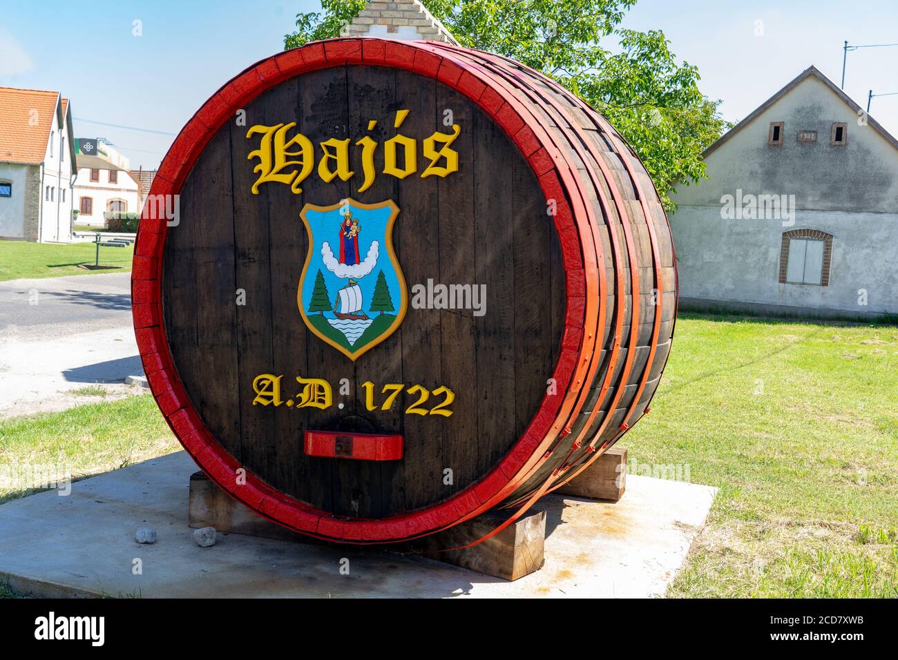 Hajos, Hungary - 08.21.2020: Barrel with village sign at the entrance of the museal colorful cellar village of Hajos with 1200 little cellars and many Stock Photo