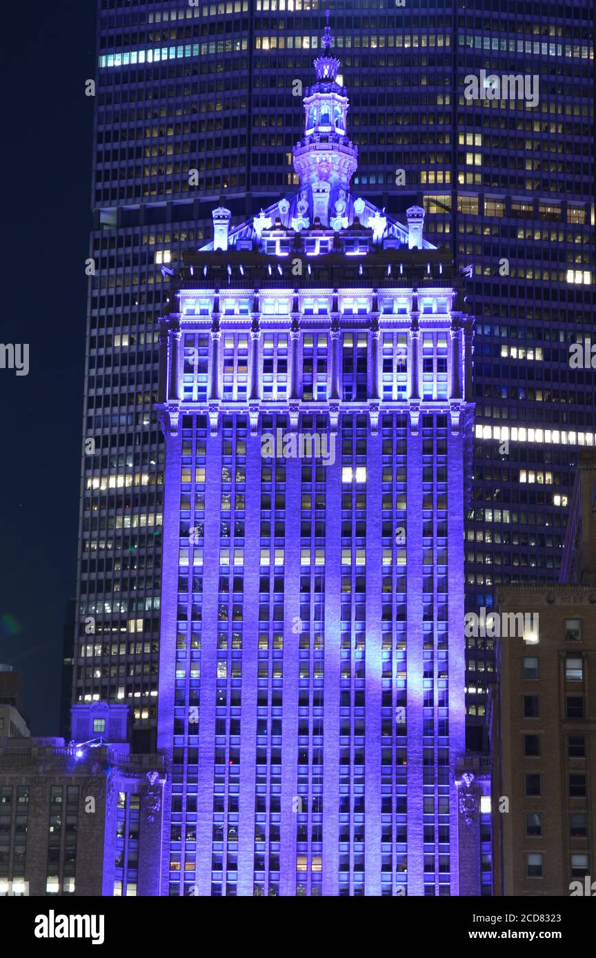 The Helmsley building in New York City was lit up purple in honor of the suffrage centennial on Women’s Equality Day (August 26, 2020). Stock Photo