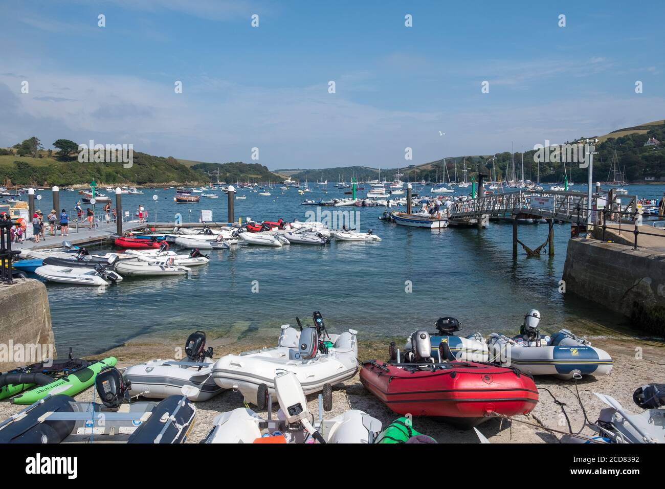 Inflatable dinghies on the slipway at Whitestrand pontoon in Salcombe, South Hams, Devon Stock Photo