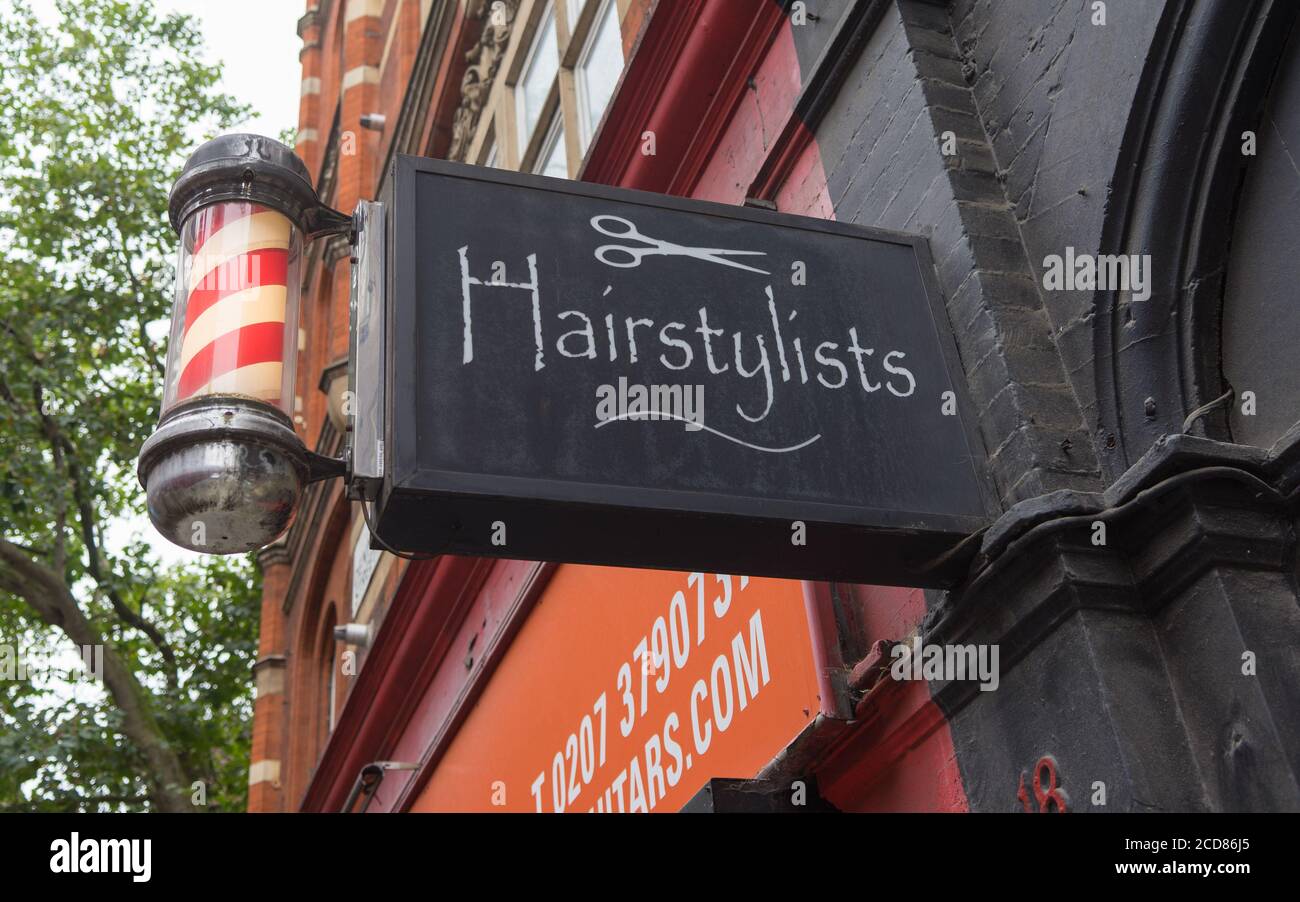 Barbers and hairstylist shop sign. London Stock Photo