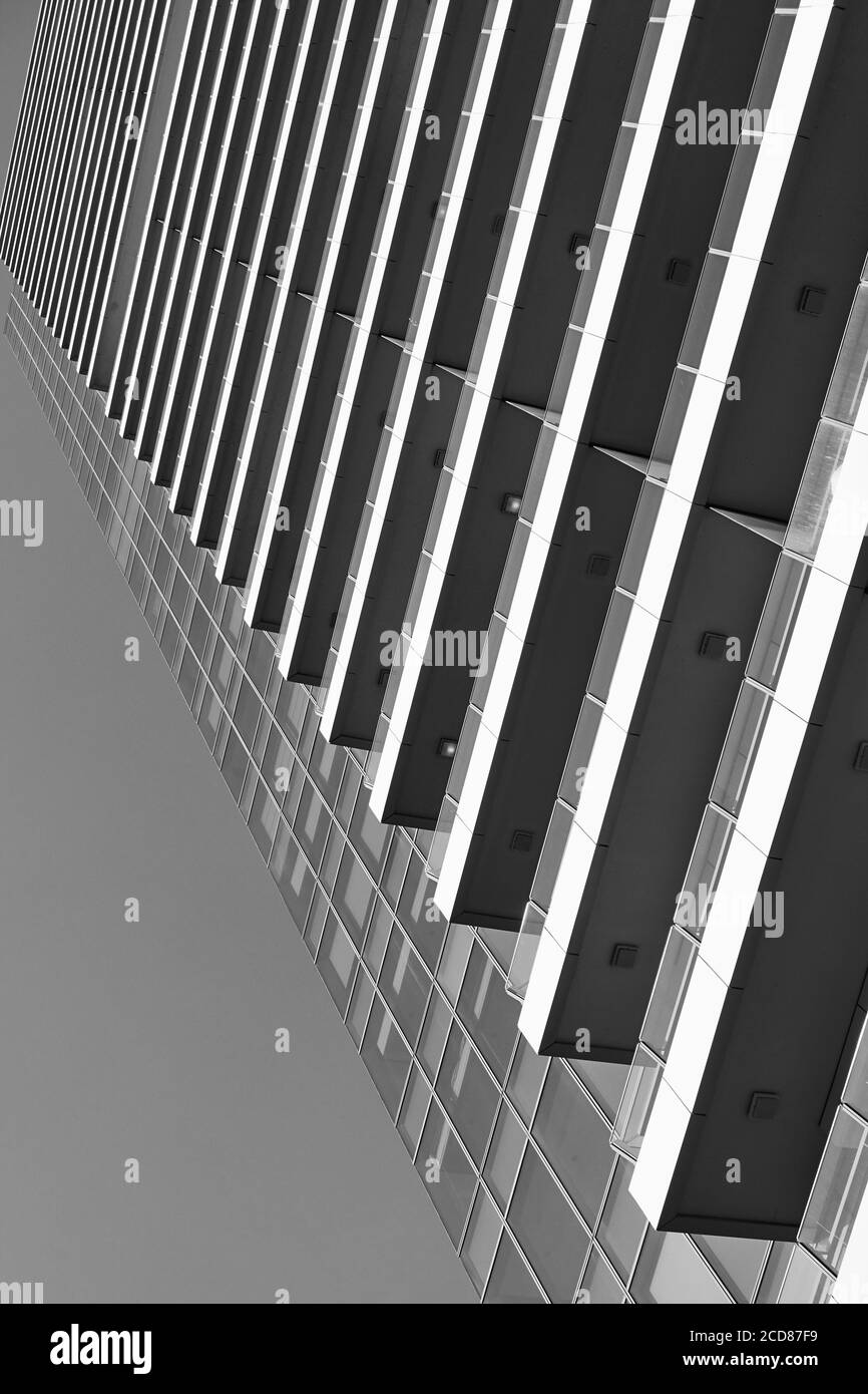 Perspective of many-storeyed apartment building. Black and white  architectural photography Stock Photo