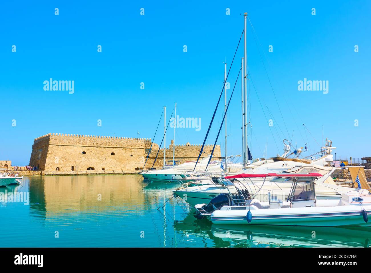 Sailing yachts n the harbour by the old venetian fortress in Heraklion, Crete island, Greece Stock Photo