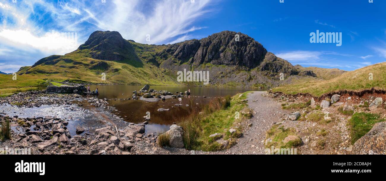 Stickle Tarn nestling under Pavey Ark fell in the Langdales. Stock Photo